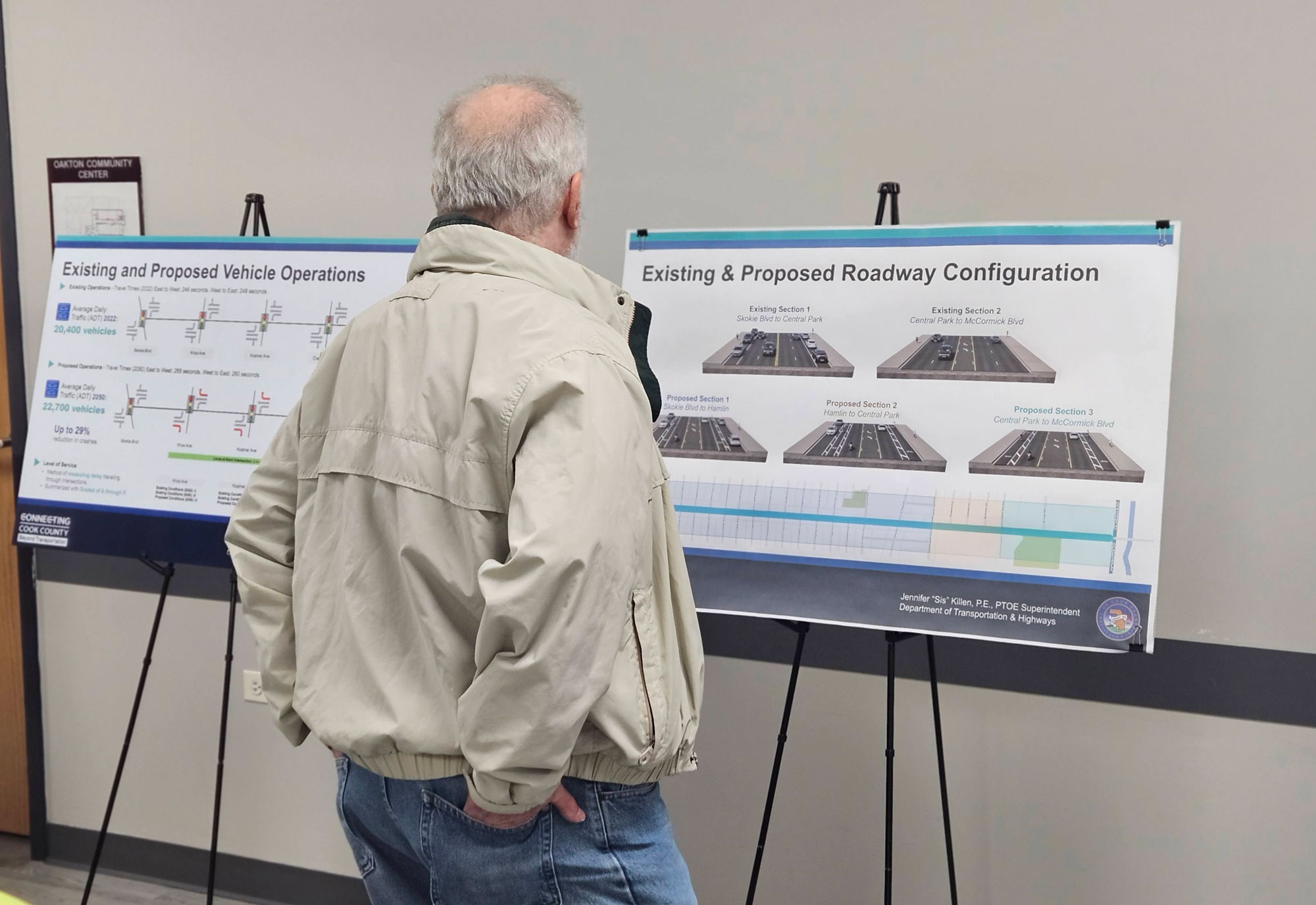 A resident looks at the proposed roadway configuration at the Oct. 10, 2024, public meeting.