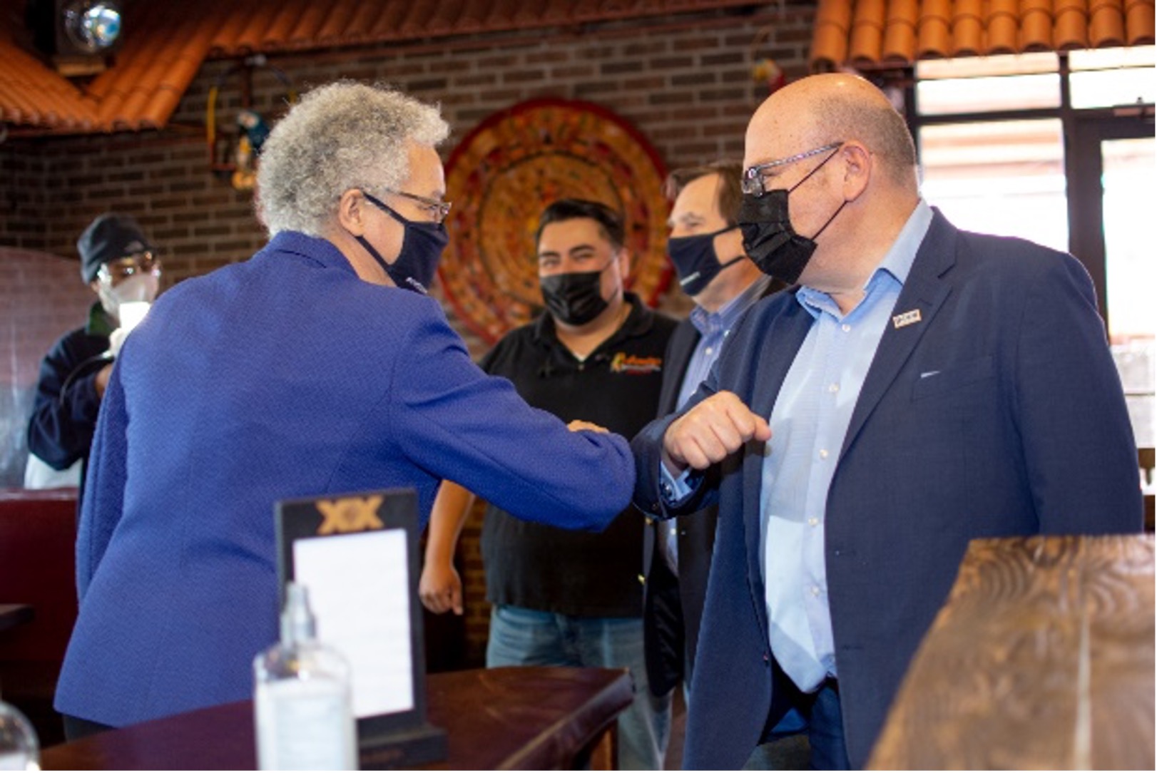 President Preckwinkle bumping elbows at Alejandra's Restaurant President Preckwinkle bumping elbows at Alejandra's Restaurant